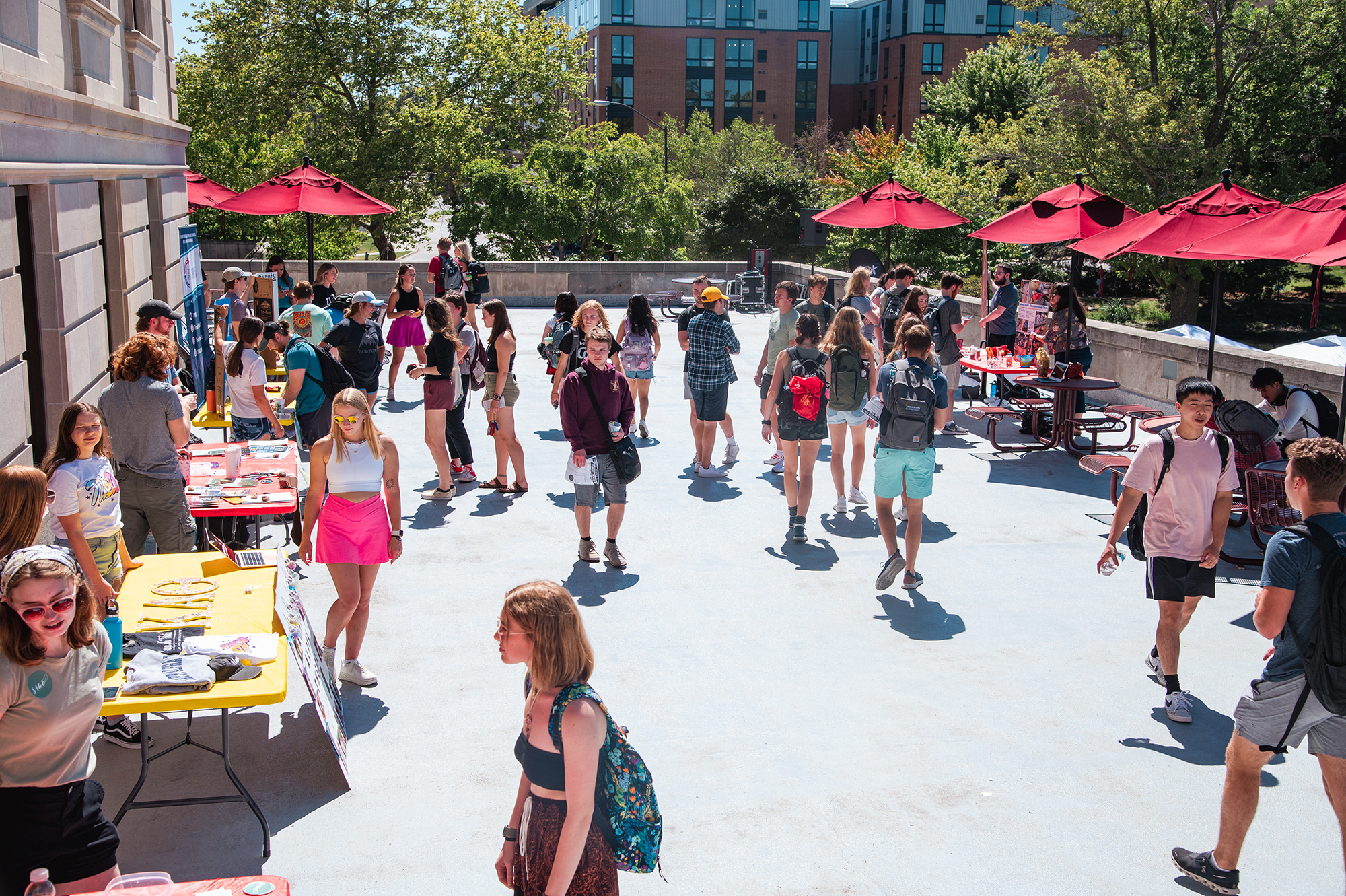 Large gathering of students on the terrace of the Memorial Union on a sunny day