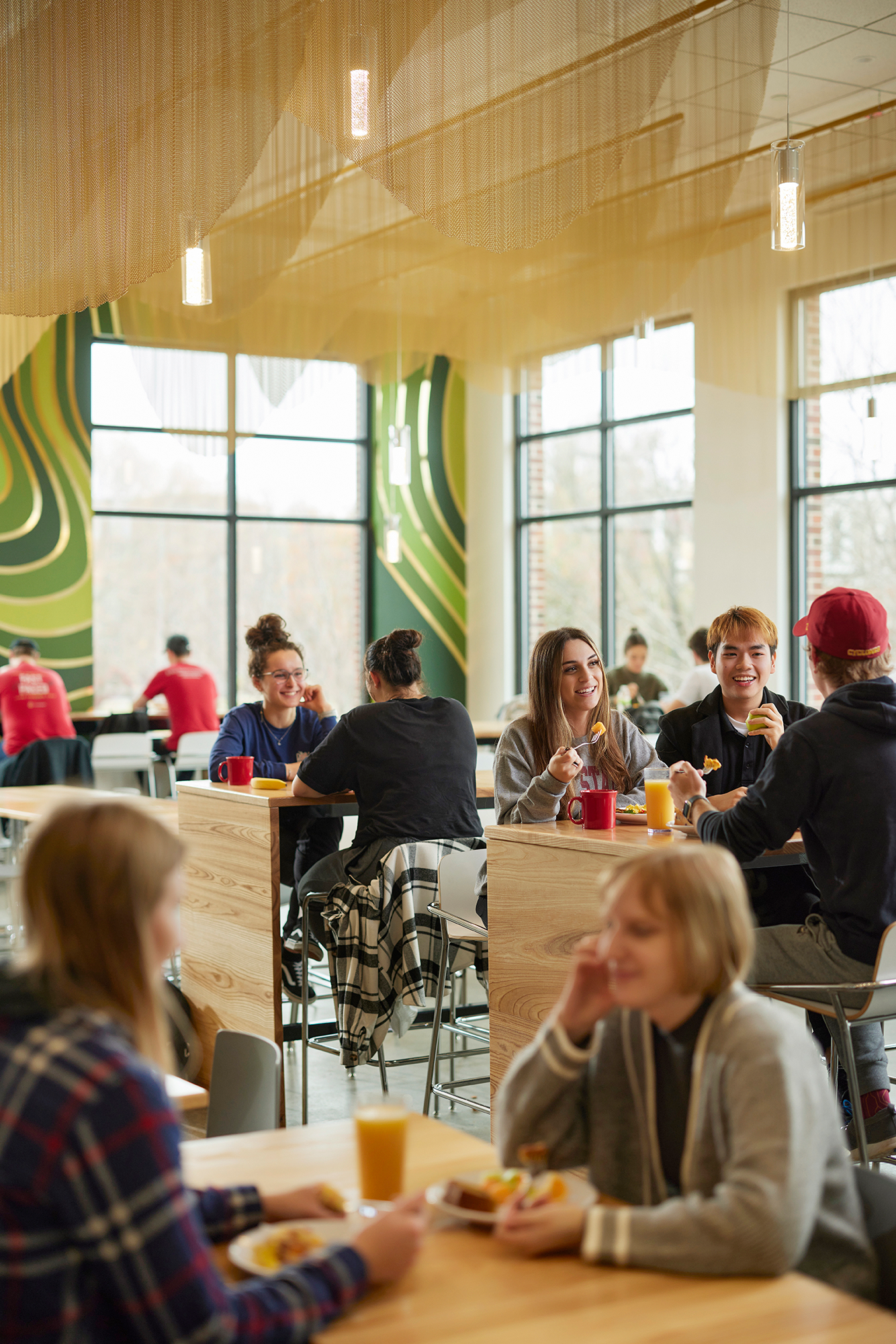 Several groups eating and talking at Union Drive Marketplace dining center